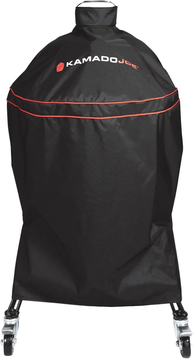 Funda oficial Kamado Joe para Classic Joe en poliéster negro, cubriendo el kamado cerámico sobre su carro (vista 1)